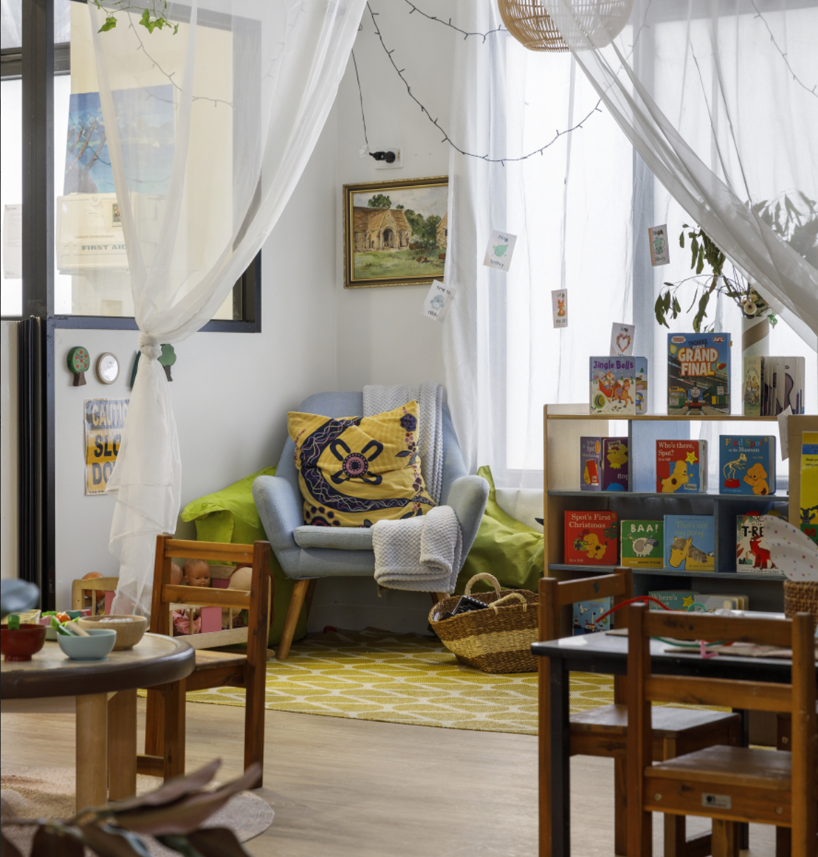 Children's play kitchen area with small furniture